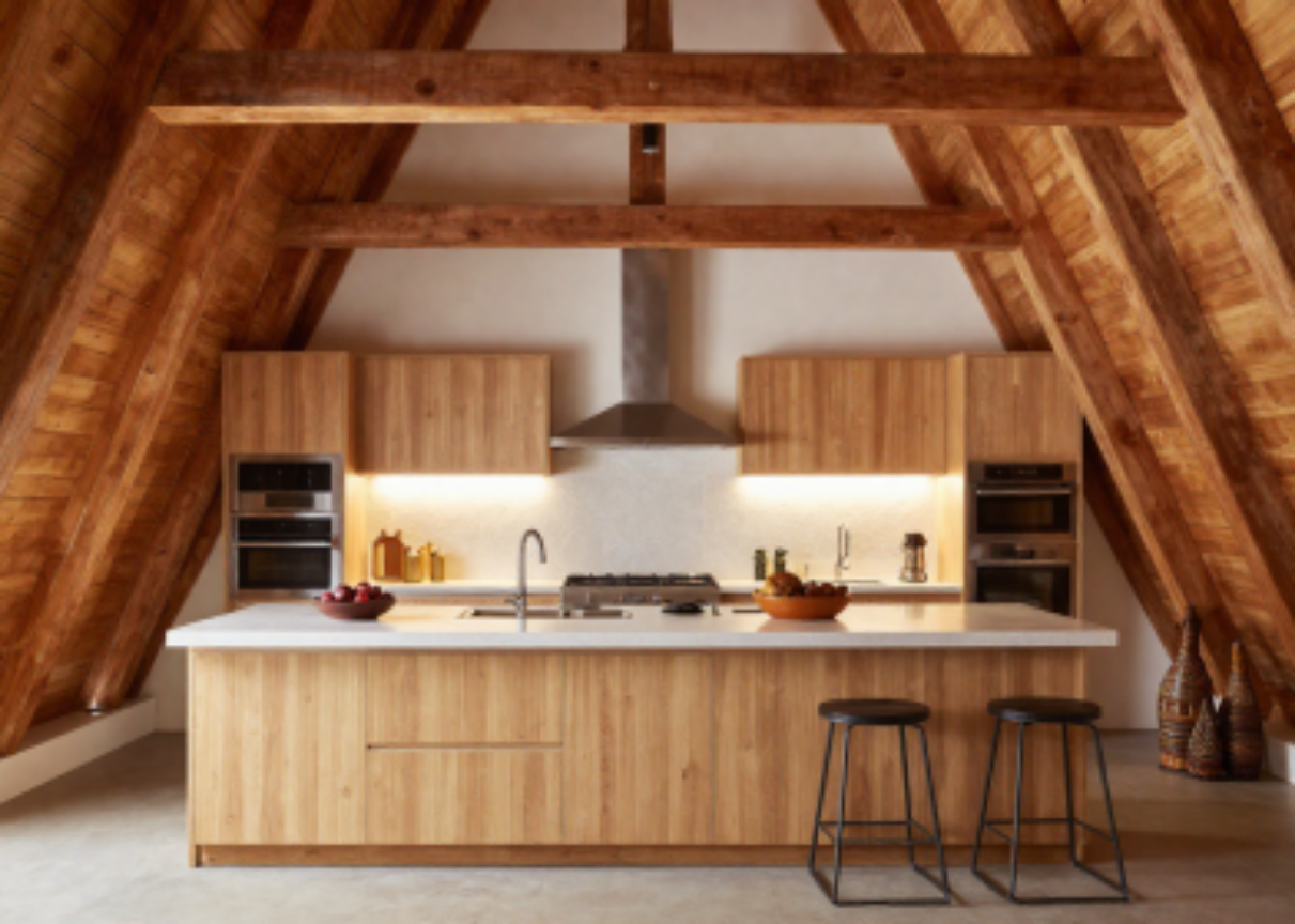 Projected kitchen — warm wood, open beams, and island seating
